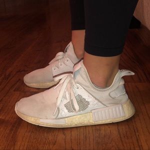 Triple white NMD shoes